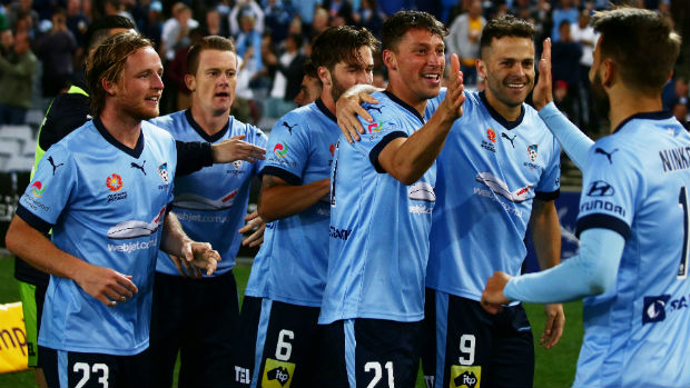Sydney FC players celebrate Filip Holosko's opener against the Wanderers at ANZ Stadium.