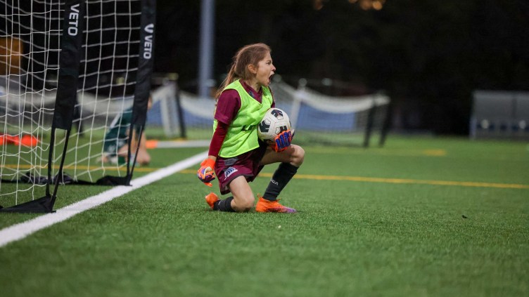 Young girl celebrates saving penalty