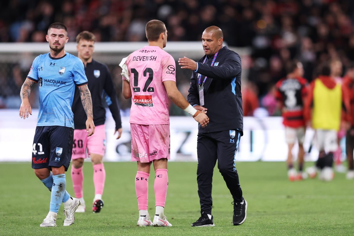 Sydney FC head coach Patrick Kisnorbo embraces Harrison Devenish-Meares of Sydney FC at full time at Allianz Stadium.