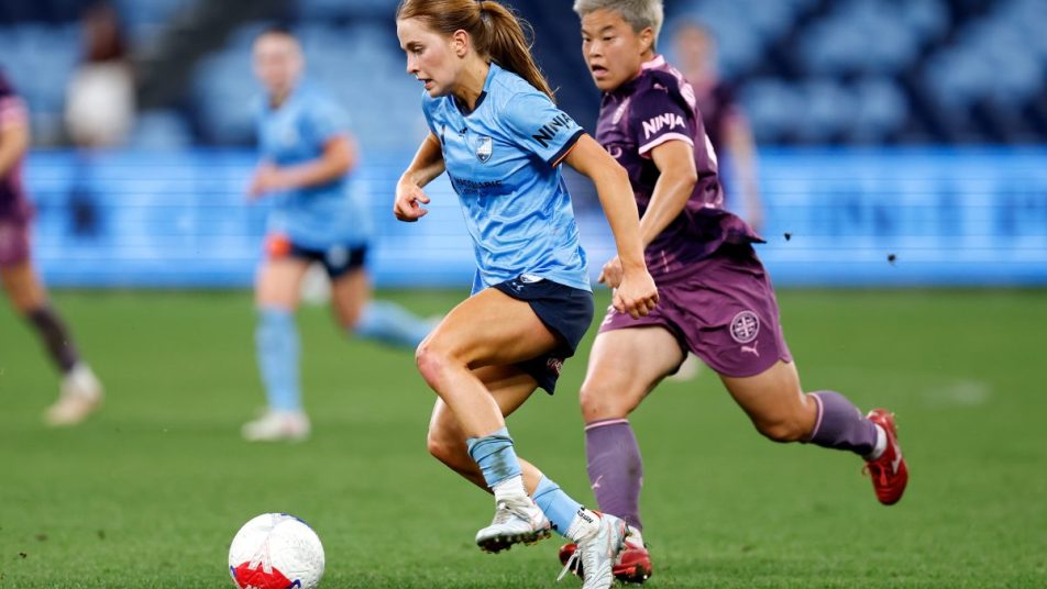 Madeleine Caspers of Sydney FC competes with Momo Hayashi of Melbourne City at Allianz Stadium.